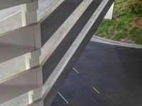 a view of a road and an overpass with traffic passing through it by buildings