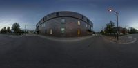 an image of a 360 - angle street scene taken at sunset with no traffic lights