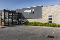 exterior view of a restaurant and patio with nooky's grill and bar