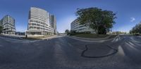 a 360 - view shows two buildings, one large and one small as the second smaller