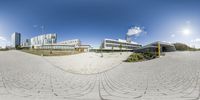 a view of the outside of an office building from the street, taken with a fish eye lens