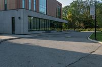 the street in front of the building is empty from cars as if it were not on the sidewalk