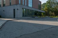 the street in front of the building is empty from cars as if it were not on the sidewalk