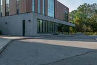 the street in front of the building is empty from cars as if it were not on the sidewalk