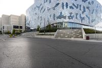 a man riding a skateboard down the middle of an empty street under a building