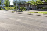 a car is stopped by the curb outside the business building on a sunny day,