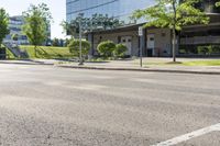 a car is stopped by the curb outside the business building on a sunny day,