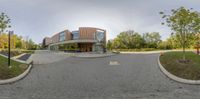 a panorama with a tree in the center and a building in the background with an arched entrance