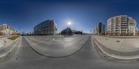 street view showing the sun and the buildings in the background and a blue sky,