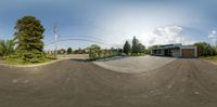 a panoramic view of a small intersection on a clear day in canada street