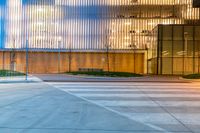 a large building that looks like it has an office on one side and a glass on the other