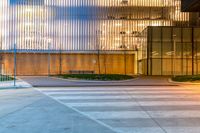 a large building that looks like it has an office on one side and a glass on the other