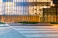 a large building that looks like it has an office on one side and a glass on the other