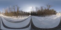 two poles, in between them and in the snow, on a hill side, are arranged at a long bend