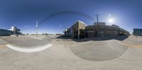 360 - view of street intersection and light pole with traffic passing in front of building