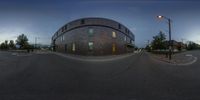 an image of a 360 - angle street scene taken at sunset with no traffic lights