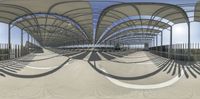 the bridge with many curves of curved metal pipes, seen from under it, with a person walking on top of it