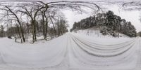 the snow covers a street as seen from the ground in the middle of winter season