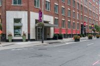 the sidewalk is painted red and blue while people walk by on the sidewalk near a building