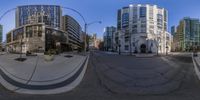 two photos of a street intersection showing the opposite way to go through the picture and a picture with buildings, streets, people walking, cars and tall buildings