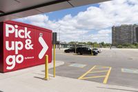 an image of a parking lot with cars parked in it and the signs advertising the place