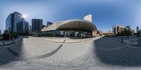 a picture of an outdoor space with many circular images and images of buildings surrounding it