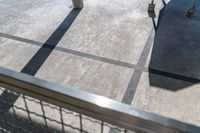 a picture looking down at the walkway and parking area in the back of a building