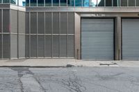 two commercial garages on a city street with the doors open and closed for business