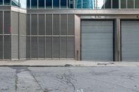 two commercial garages on a city street with the doors open and closed for business