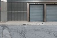 two commercial garages on a city street with the doors open and closed for business