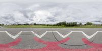 a view from inside the air with some red and white arrows drawn on it and a sky in the background