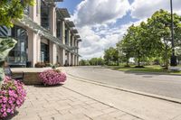 this city street looks like a deserted country side town center with many plants and flowers