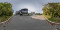 a photo taken through the fish eye lens of a building near the side of the street