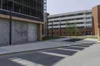 a red fire hydrant sits on the sidewalk near an empty sidewalk in front of buildings