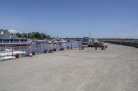 the dock on the waterfront of the small village in ontario, with many boats docked