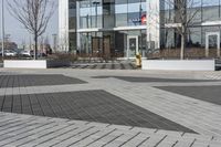 this is an outdoor space with a lot of tiles on it in a large open courtyard