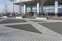 this is an outdoor space with a lot of tiles on it in a large open courtyard