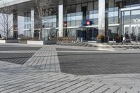 this is an outdoor space with a lot of tiles on it in a large open courtyard