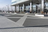 this is an outdoor space with a lot of tiles on it in a large open courtyard