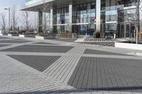 this is an outdoor space with a lot of tiles on it in a large open courtyard