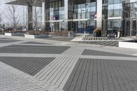 this is an outdoor space with a lot of tiles on it in a large open courtyard