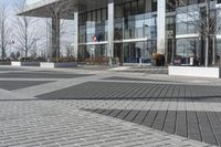 this is an outdoor space with a lot of tiles on it in a large open courtyard