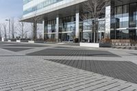 this is an outdoor space with a lot of tiles on it in a large open courtyard