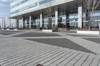 this is an outdoor space with a lot of tiles on it in a large open courtyard