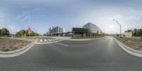 a circular picture of a road outside a building on the other side of the street