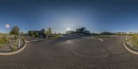 this 360 - angle picture of the empty road is so perfect it appears to be in midair