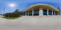 the front entrance to the building is shown from a fish eye lens with the lens pointed out