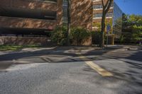 a stop sign on a city street by tall buildings in a city area of an urban setting