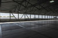 the interior of a warehouse building with metal mesh coverings and a concrete floor and walkway