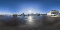 a large empty parking lot with cars parked outside it is bright in the sun shining